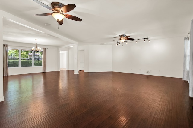 empty room with ceiling fan with notable chandelier and dark hardwood / wood-style flooring