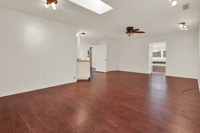 unfurnished living room with dark hardwood / wood-style floors and ceiling fan