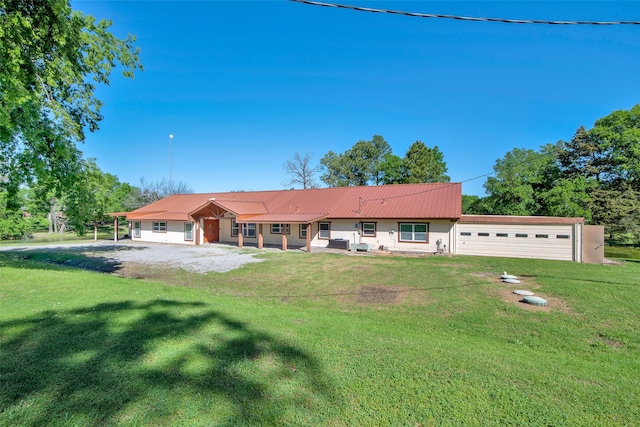 ranch-style home with a front yard and a garage