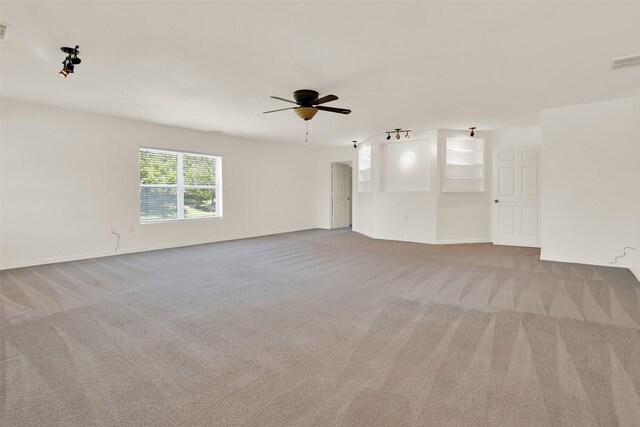 carpeted empty room with ceiling fan