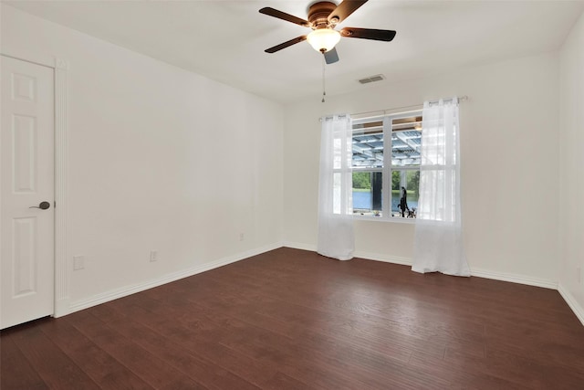 191 Old Perrin Rd, Sherman, TX 75092 - unfurnished room with dark wood-style floors, ceiling fan, and baseboards