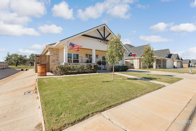 view of front of home with a front lawn and covered porch