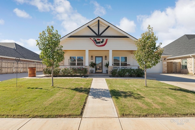 view of front of home with a front yard and a porch