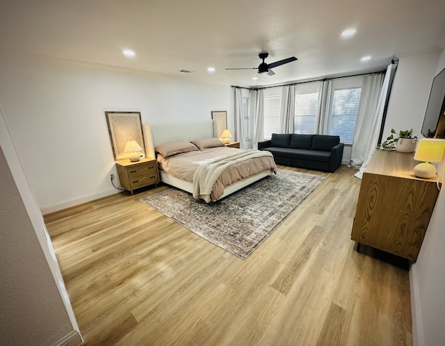 bedroom featuring ceiling fan and light hardwood / wood-style flooring