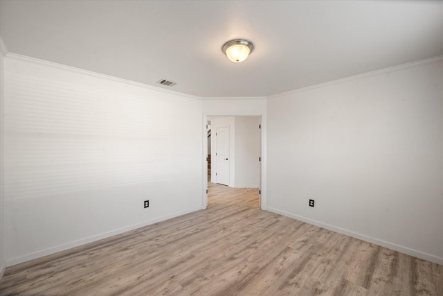 interior space featuring crown molding and light hardwood / wood-style flooring