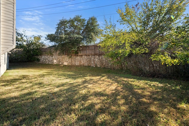 rear view of property featuring a lawn