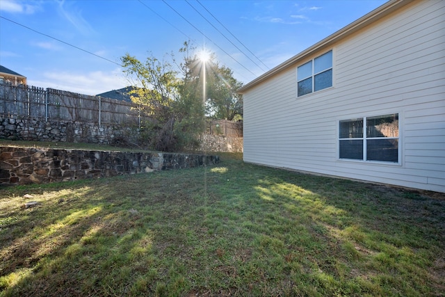 view of home's exterior with a lawn