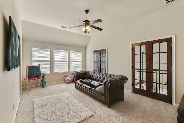 living room with french doors, visible vents, and light colored carpet