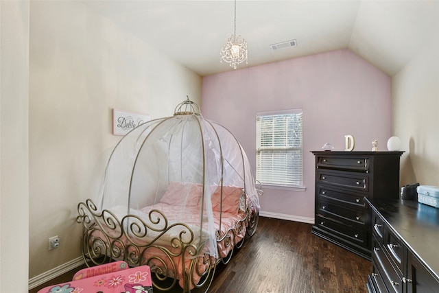 bedroom with baseboards, visible vents, dark wood finished floors, vaulted ceiling, and a notable chandelier