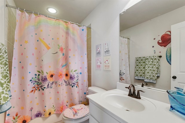 full bath featuring toilet, vanity, and a shower with curtain