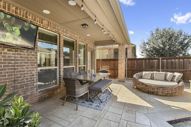 view of patio with an outdoor hangout area, outdoor dining space, and fence