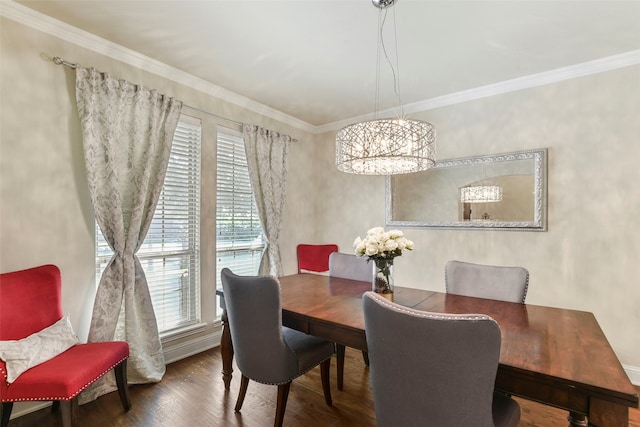 dining room featuring ornamental molding, wood finished floors, and a notable chandelier