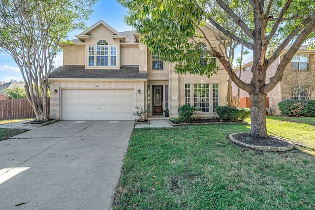 view of front of house featuring a front yard and a garage