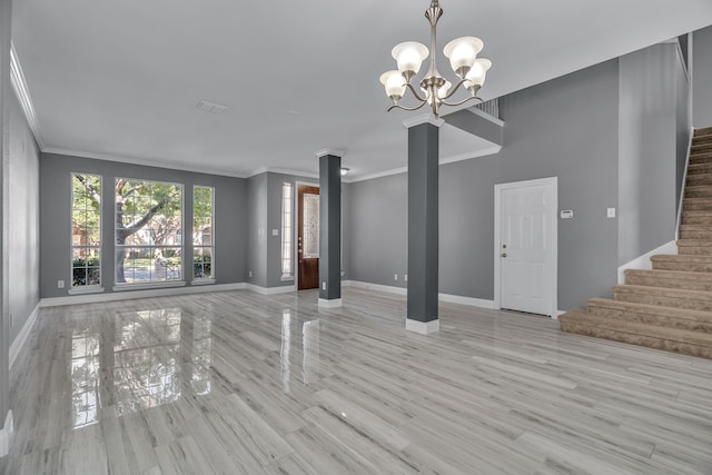 unfurnished living room featuring a chandelier, light hardwood / wood-style flooring, and ornamental molding