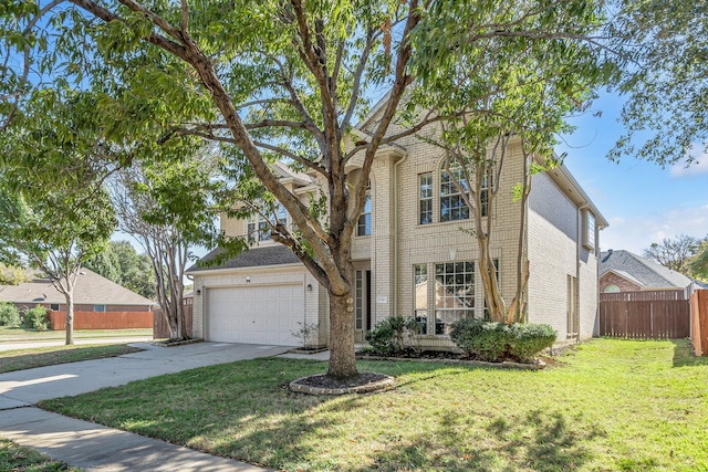 view of front of home with a front yard and a garage