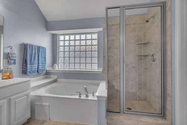 bathroom with vanity, plus walk in shower, and vaulted ceiling