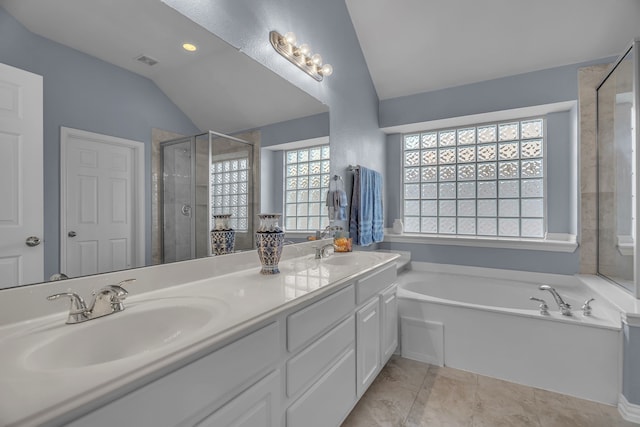 bathroom with vanity, independent shower and bath, and lofted ceiling