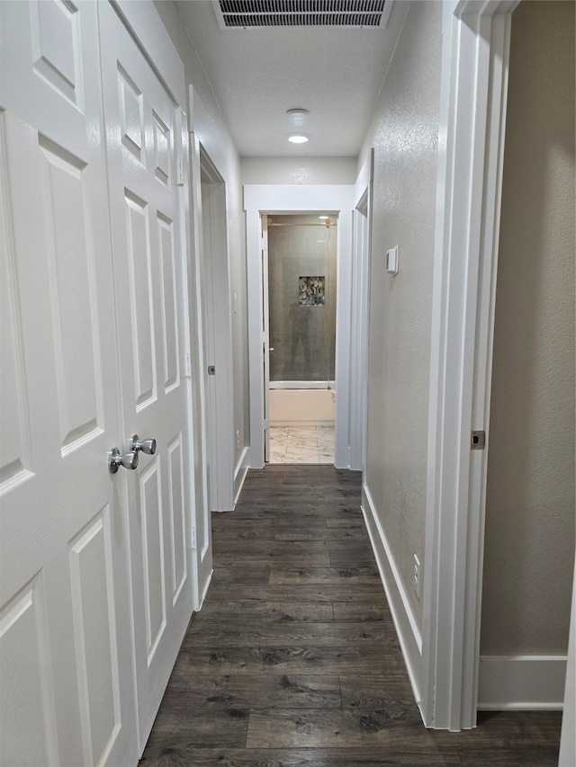 hallway featuring dark hardwood / wood-style floors