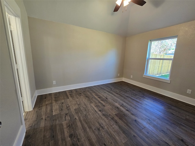 spare room with lofted ceiling, ceiling fan, and dark hardwood / wood-style floors