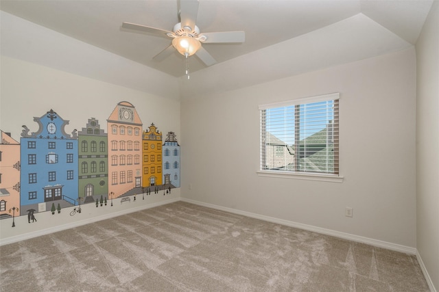 unfurnished room with ceiling fan, carpet floors, lofted ceiling, and baseboards