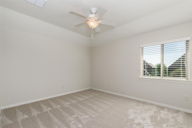 empty room with light carpet, visible vents, baseboards, and a ceiling fan