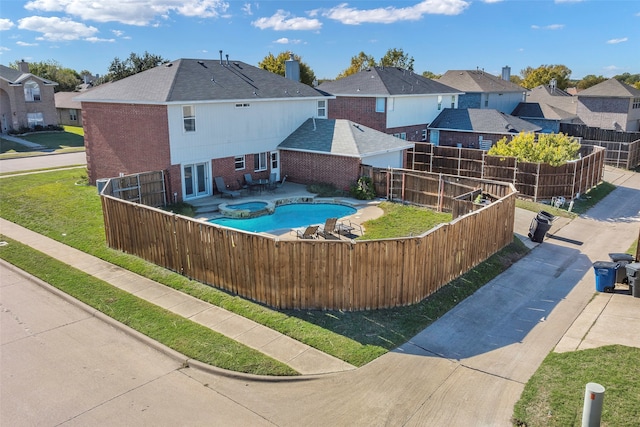 view of pool with a yard, french doors, and a patio