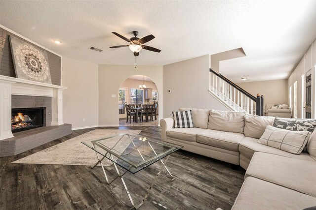 carpeted bedroom featuring ceiling fan and a textured ceiling