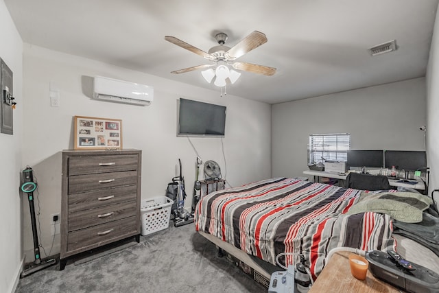 carpeted bedroom with a wall mounted AC and ceiling fan