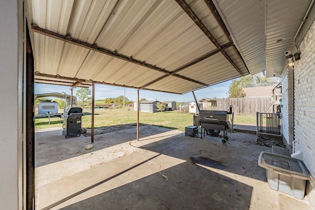 view of patio featuring a storage unit