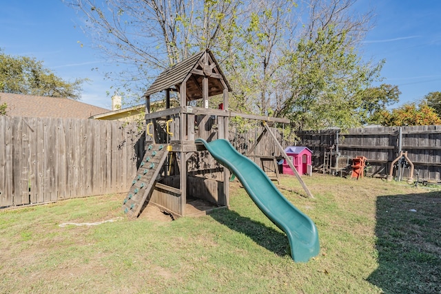 view of jungle gym with a lawn