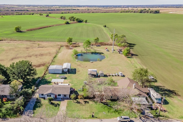 birds eye view of property with a rural view and a water view