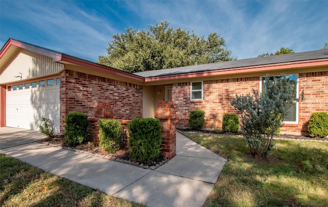 ranch-style home with a garage