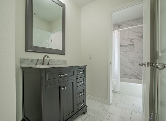 full bathroom featuring vanity, shower / bath combo, and toilet