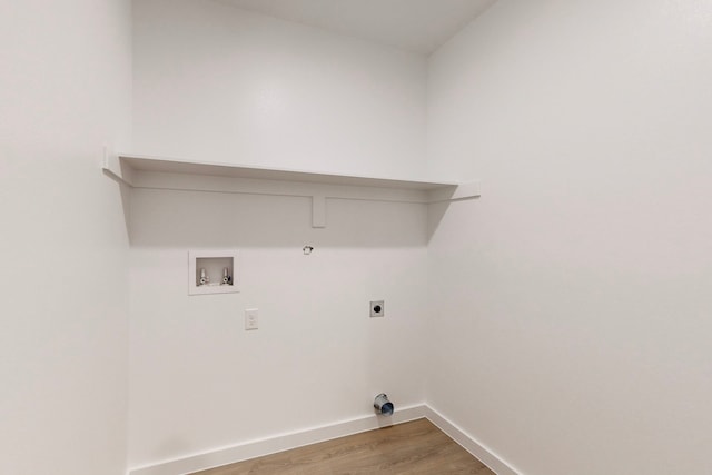 laundry area featuring electric dryer hookup, gas dryer hookup, hookup for a washing machine, and wood-type flooring