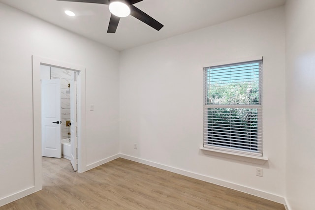 unfurnished room with ceiling fan and light hardwood / wood-style floors