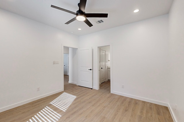 unfurnished bedroom with ceiling fan and light hardwood / wood-style floors