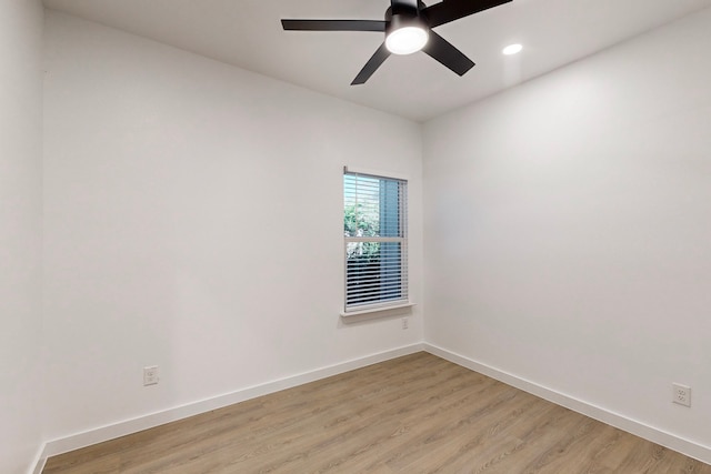 unfurnished room featuring light wood-type flooring and ceiling fan