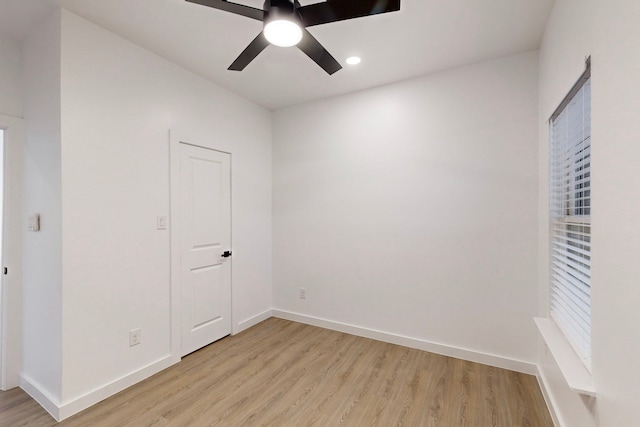 spare room with ceiling fan and light hardwood / wood-style flooring