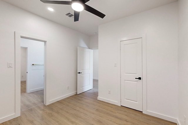 unfurnished bedroom featuring ceiling fan and light wood-type flooring