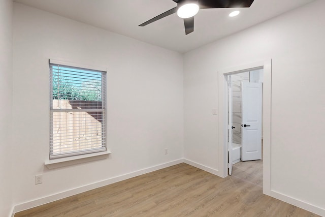 spare room featuring ceiling fan and light wood-type flooring