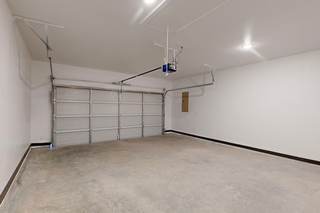 garage featuring electric panel and a garage door opener