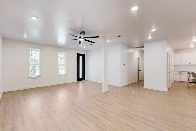 unfurnished living room with light hardwood / wood-style floors and ceiling fan