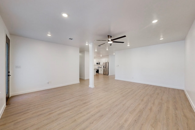 unfurnished living room with ceiling fan and light wood-type flooring