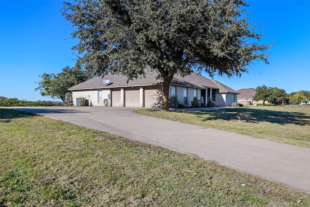 ranch-style home with a front yard and a garage