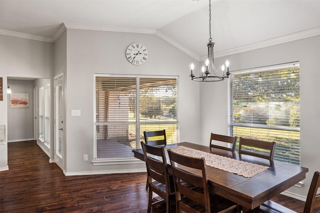 dining space featuring a chandelier, dark wood-type flooring, lofted ceiling, and ornamental molding