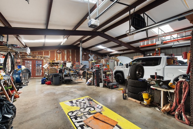 garage featuring a workshop area and a garage door opener