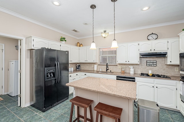 kitchen with black appliances, a center island, sink, and hanging light fixtures