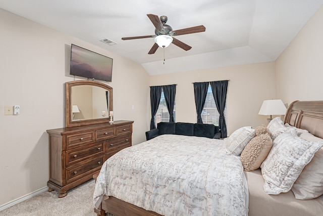 bedroom with ceiling fan, light colored carpet, and lofted ceiling