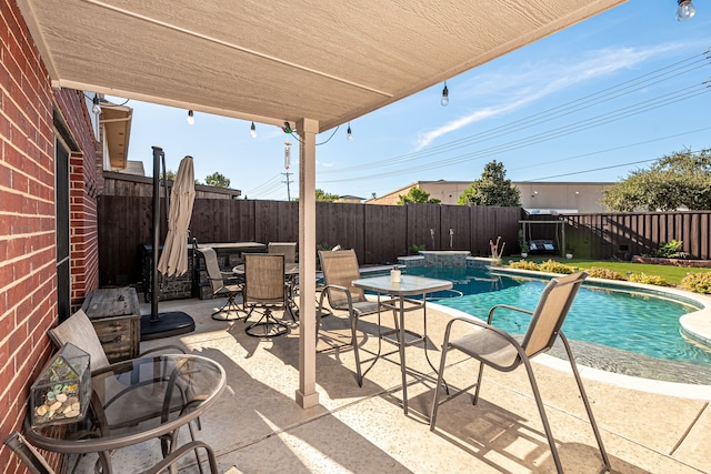 view of swimming pool featuring a patio