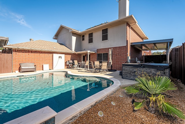 view of pool featuring a patio area